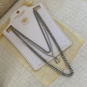 Lux Eye Candy titanium layered padlock necklace.